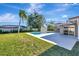 Large backyard with pool, lawn and palm tree at 2851 Hardee Dr, Sarasota, FL 34231