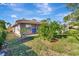 Landscaped backyard with fruit trees and pool view at 2851 Hardee Dr, Sarasota, FL 34231