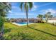 Spacious backyard with pool and lush lawn at 2851 Hardee Dr, Sarasota, FL 34231