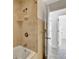 Bathroom with shower/tub combo and beige tile at 2851 Hardee Dr, Sarasota, FL 34231