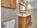 Bathroom with double vanity and beige tile at 2851 Hardee Dr, Sarasota, FL 34231