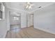 Bright bedroom with mirrored closet doors and laminate flooring at 2851 Hardee Dr, Sarasota, FL 34231