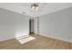 Bright bedroom with wood-look floors and ceiling fan at 2851 Hardee Dr, Sarasota, FL 34231