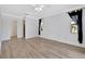 Large bedroom with wood-look flooring and walk-in closet at 2851 Hardee Dr, Sarasota, FL 34231