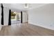Bright bedroom with wood-look floors and sliding glass doors leading to the pool at 2851 Hardee Dr, Sarasota, FL 34231