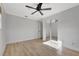 Bedroom with mirrored closet doors and ceiling fan at 2851 Hardee Dr, Sarasota, FL 34231