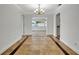 Elegant dining room, chandelier, and tile flooring at 2851 Hardee Dr, Sarasota, FL 34231