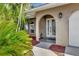 Front entry with arched doorway and glass details at 2851 Hardee Dr, Sarasota, FL 34231