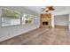 Spacious Gathering room featuring a stone fireplace and tile flooring at 2851 Hardee Dr, Sarasota, FL 34231