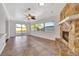 Gathering room with fireplace and tiled floor, access to backyard at 2851 Hardee Dr, Sarasota, FL 34231