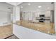 Modern kitchen with granite countertops and stainless steel appliances at 2851 Hardee Dr, Sarasota, FL 34231