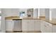 Bright kitchen, granite countertops, stainless steel dishwasher at 2851 Hardee Dr, Sarasota, FL 34231