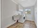 Laundry room with washer, dryer, and utility sink at 2851 Hardee Dr, Sarasota, FL 34231