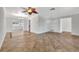 Spacious living room with tile floors and ceiling fan at 2851 Hardee Dr, Sarasota, FL 34231