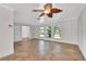 Living room with vaulted ceiling, tile floors, and ceiling fan at 2851 Hardee Dr, Sarasota, FL 34231