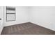 Bright bedroom with neutral carpeting and large window at 29603 Fedora Cir, Brooksville, FL 34602