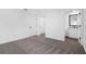 Bedroom with gray carpeting and en-suite bathroom at 29603 Fedora Cir, Brooksville, FL 34602