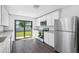 Modern kitchen with stainless steel appliances and granite countertops at 29603 Fedora Cir, Brooksville, FL 34602