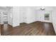 Spacious living room with wood-look flooring and ceiling fan at 29603 Fedora Cir, Brooksville, FL 34602
