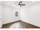 Spacious bedroom with hardwood floors and a ceiling fan at 320 W Jean St, Tampa, FL 33604