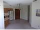 Open kitchen with wood cabinets and a refrigerator at 37819 Alissa Dr # C, Zephyrhills, FL 33542