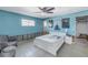 A light blue bedroom with a bed, tiled floors, and water damage at 4000 14Th Ne St, St Petersburg, FL 33703