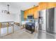 Stainless steel range and refrigerator in a kitchen undergoing renovation at 4000 14Th Ne St, St Petersburg, FL 33703