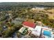 Aerial view showing community pool, tennis courts, and recreation center at 403 Weeburn Rd, Temple Terrace, FL 33617