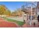 Back yard with a pool, outdoor seating, and spiral staircase at 403 Weeburn Rd, Temple Terrace, FL 33617