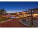 Expansive backyard featuring a pool, lounging areas, a firepit, mature trees, and lovely landscaping at 403 Weeburn Rd, Temple Terrace, FL 33617