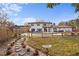 Beautiful backyard featuring a fence, artificial turf, and a serene lounging area at 403 Weeburn Rd, Temple Terrace, FL 33617