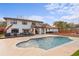 Exterior of a two-story home featuring a pristine pool, patio, balcony and beautifully landscaped backyard at 403 Weeburn Rd, Temple Terrace, FL 33617