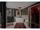 Luxurious bathroom featuring a soaking tub, walk-in sauna and black vanity for a relaxing retreat at 403 Weeburn Rd, Temple Terrace, FL 33617