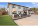 Lovely exterior patio with nice patio seating and artificial grass, great for outdoor entertaining at 403 Weeburn Rd, Temple Terrace, FL 33617