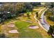 A picturesque golf course with sand traps and a green, perfect for golfing enthusiasts at 403 Weeburn Rd, Temple Terrace, FL 33617