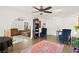 Spacious living room with tile floors and view of arched entryway leading to seating area at 403 Weeburn Rd, Temple Terrace, FL 33617