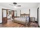 Spacious main bedroom with ensuite bathroom and hardwood floors at 403 Weeburn Rd, Temple Terrace, FL 33617