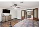 Large main bedroom with hardwood floors and stylish furniture at 403 Weeburn Rd, Temple Terrace, FL 33617