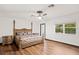 Bright main bedroom featuring hardwood floors and large windows at 403 Weeburn Rd, Temple Terrace, FL 33617