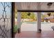 Covered patio offering views of the beautiful backyard with a swimming pool at 403 Weeburn Rd, Temple Terrace, FL 33617