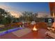 Rooftop deck with a sunset view, fire pit, and comfortable seating at 403 Weeburn Rd, Temple Terrace, FL 33617
