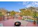 Relaxing rooftop deck with pool views and a cozy fire pit at 403 Weeburn Rd, Temple Terrace, FL 33617