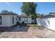 Home features a large backyard with a concrete patio and a white vinyl fence at 4335 10Th S Ave, St Petersburg, FL 33711