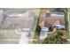 Aerial view showing two homes with pools at 4726 Windflower Cir, Tampa, FL 33624