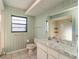 Bathroom with a bathtub, toilet and vanity at 4726 Windflower Cir, Tampa, FL 33624