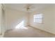 Bright bedroom featuring a ceiling fan and window with blinds at 4726 Windflower Cir, Tampa, FL 33624
