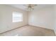 Well-lit bedroom with ceiling fan and window blinds at 4726 Windflower Cir, Tampa, FL 33624