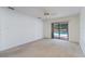 Bright bedroom with pool view and sliding glass doors at 4726 Windflower Cir, Tampa, FL 33624