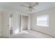Bedroom with ceiling fan, window, and closet at 4726 Windflower Cir, Tampa, FL 33624