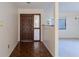 The entryway features a parquet floor and a traditional wooden door at 4726 Windflower Cir, Tampa, FL 33624